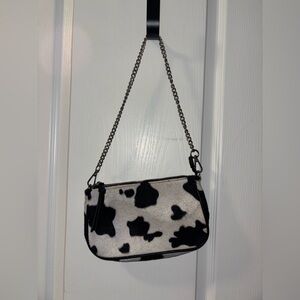 Furry cow print purse